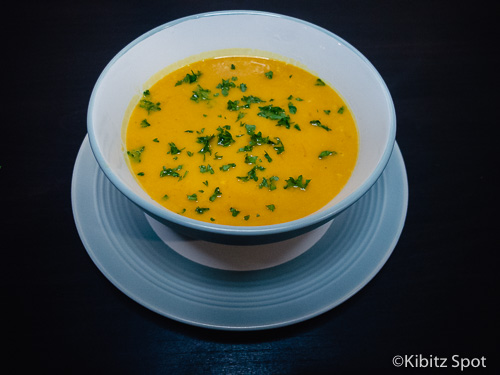 a bowl of gluten-fre pumpkin soup ready to eat
