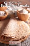 A stack of buckwheat pancakes with ingredients in the background.