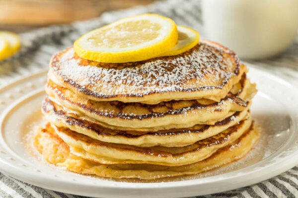 Homemade gluten-free pancakes with lemon powdered sugar