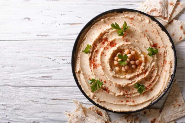 Chickpea hummus and gluten-free pita bread.