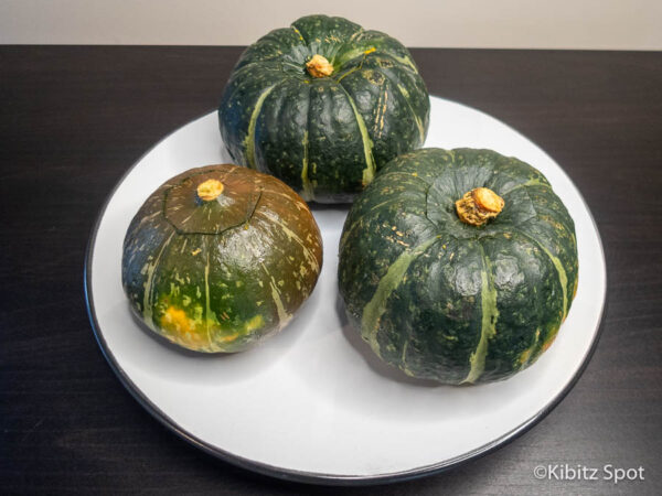 Three small kabocha squash on a plate