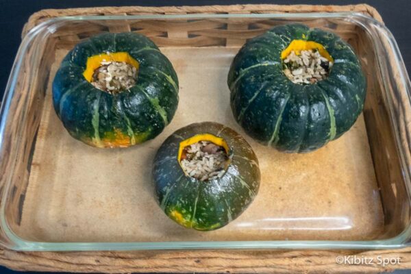 stuffed sabocha squash in the baking pan before roasting.