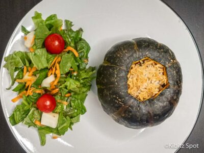 A plate made from our delicious stuffed kabocha squash recipe along with a side salad.