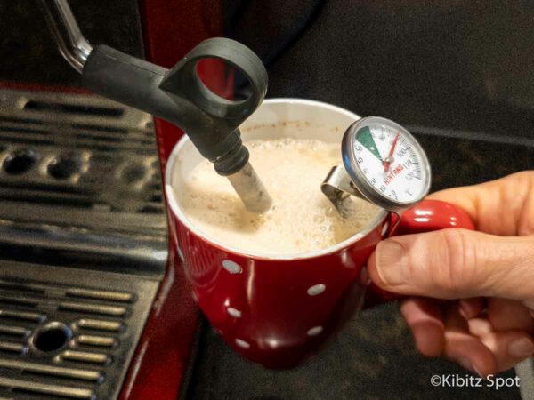 Chai latte being made with an espresso machine