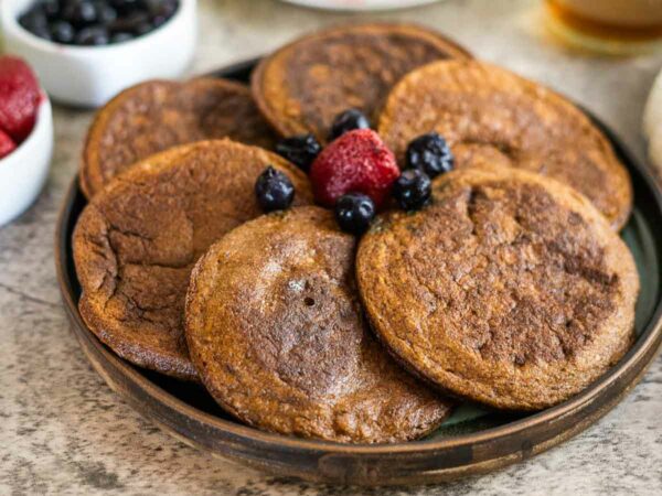 flaxseed pancakes with berries on a plate