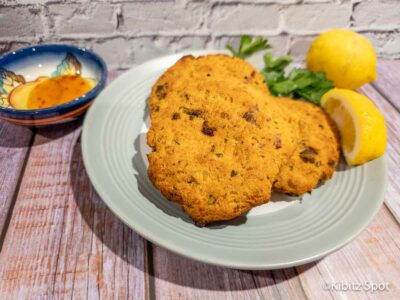 Gluten-free salmon patties made in an air fryer on a plate. .