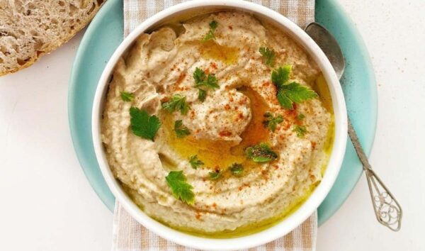 A bowl of baba ganoush on a gluten-free mezze platter