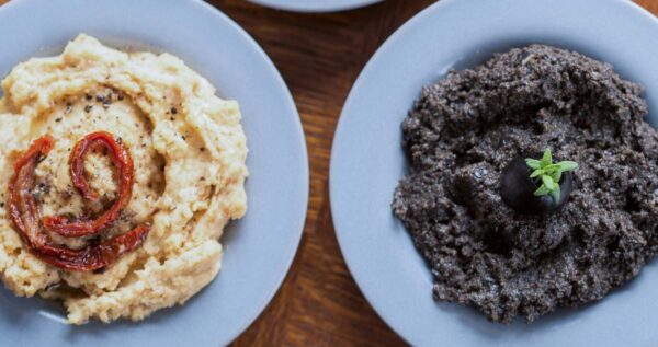 A section of a mezze platter with a bowl of hummus and our easy olive tapenade