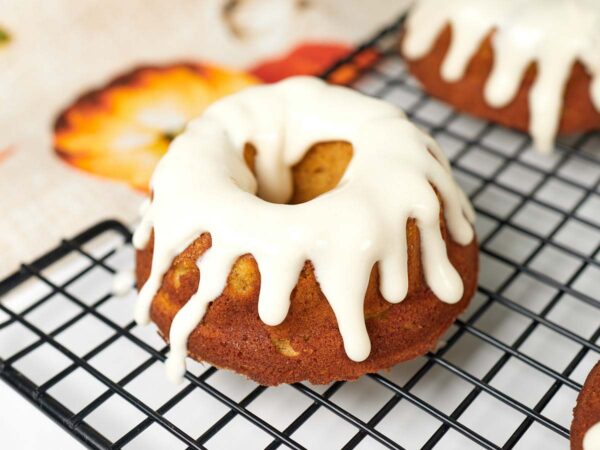 A frosted mini pumpkin bundt cake