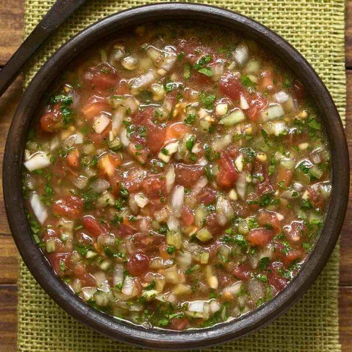 A bowl of Chilean pebre (tomato and onion salsa)